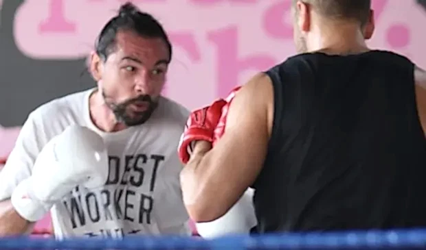 Jason Woodham, a Muay Thai trainer, coaching a student